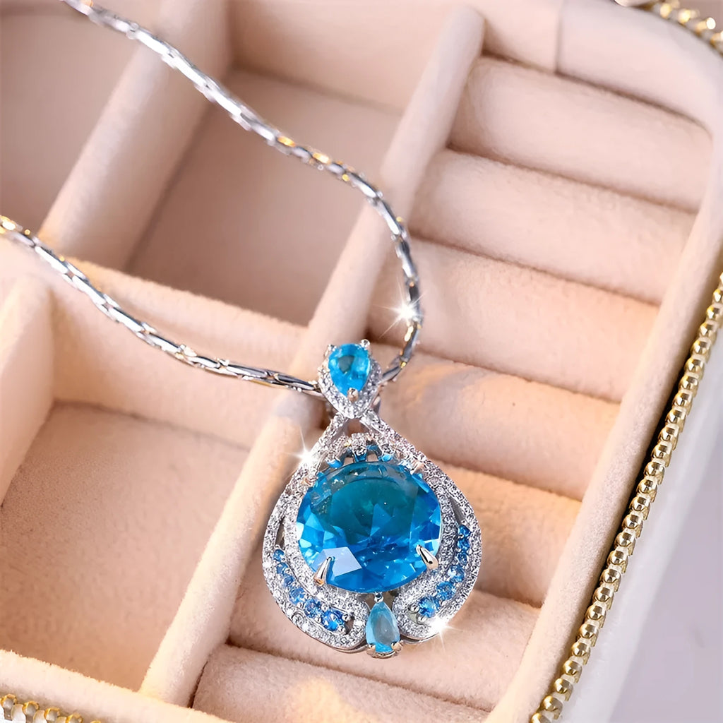Geometric women's necklace with blue crystal fireworks cut pendant on water wave chain