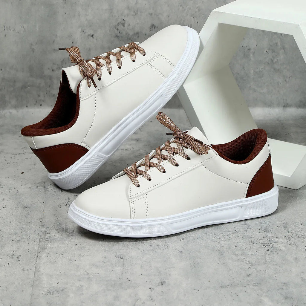 Casual beige brown platform sneakers with a cross strap and round toe on a flat rubber sole.