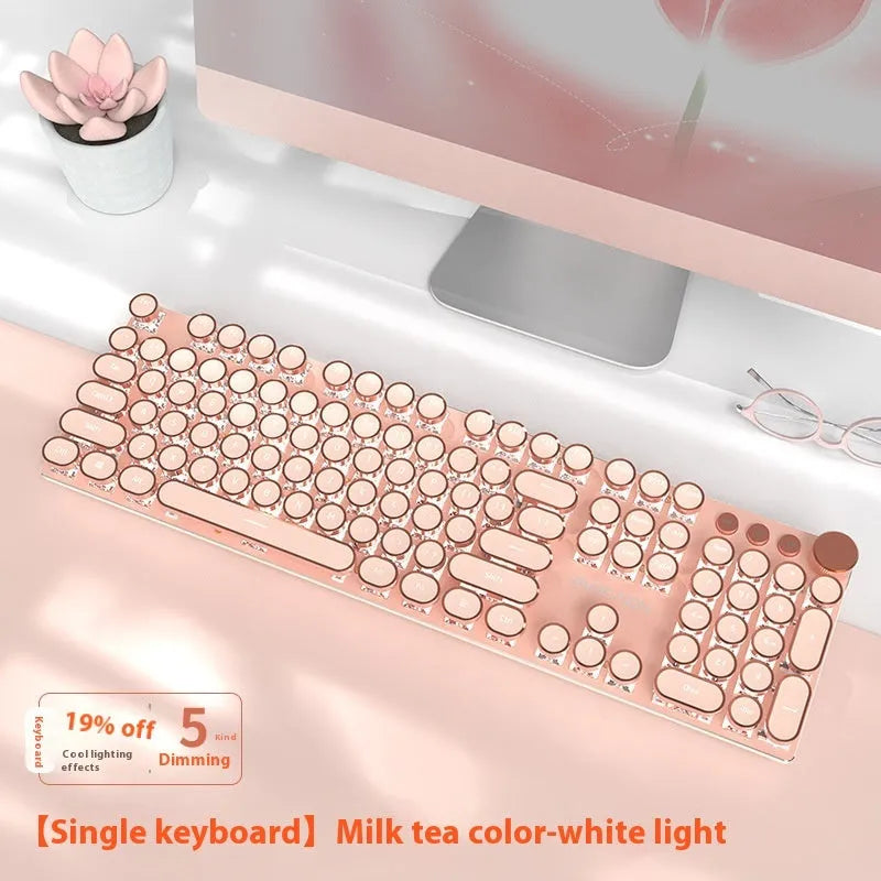 Matcha green mechanical gaming keyboard with multifunction knob on a desk