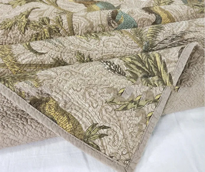 Blue American floral quilted cotton bedspread set on a bed, showing the three-piece 230x250 cm cover.