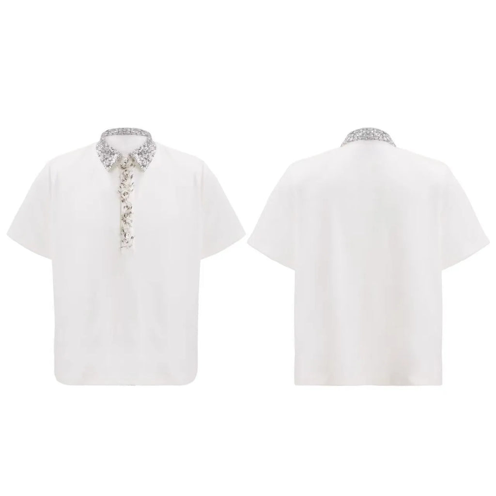 Men's black loose-fit polo t-shirt with square collar, pin, and heavy embroidery sequin detail on the chest.