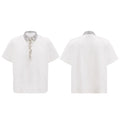 Men's black loose-fit polo t-shirt with square collar, pin, and heavy embroidery sequin detail on the chest.
