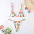 Women's floral print polyester bikini swimsuit in rose red, white, blue, or sky blue with adjustable bra