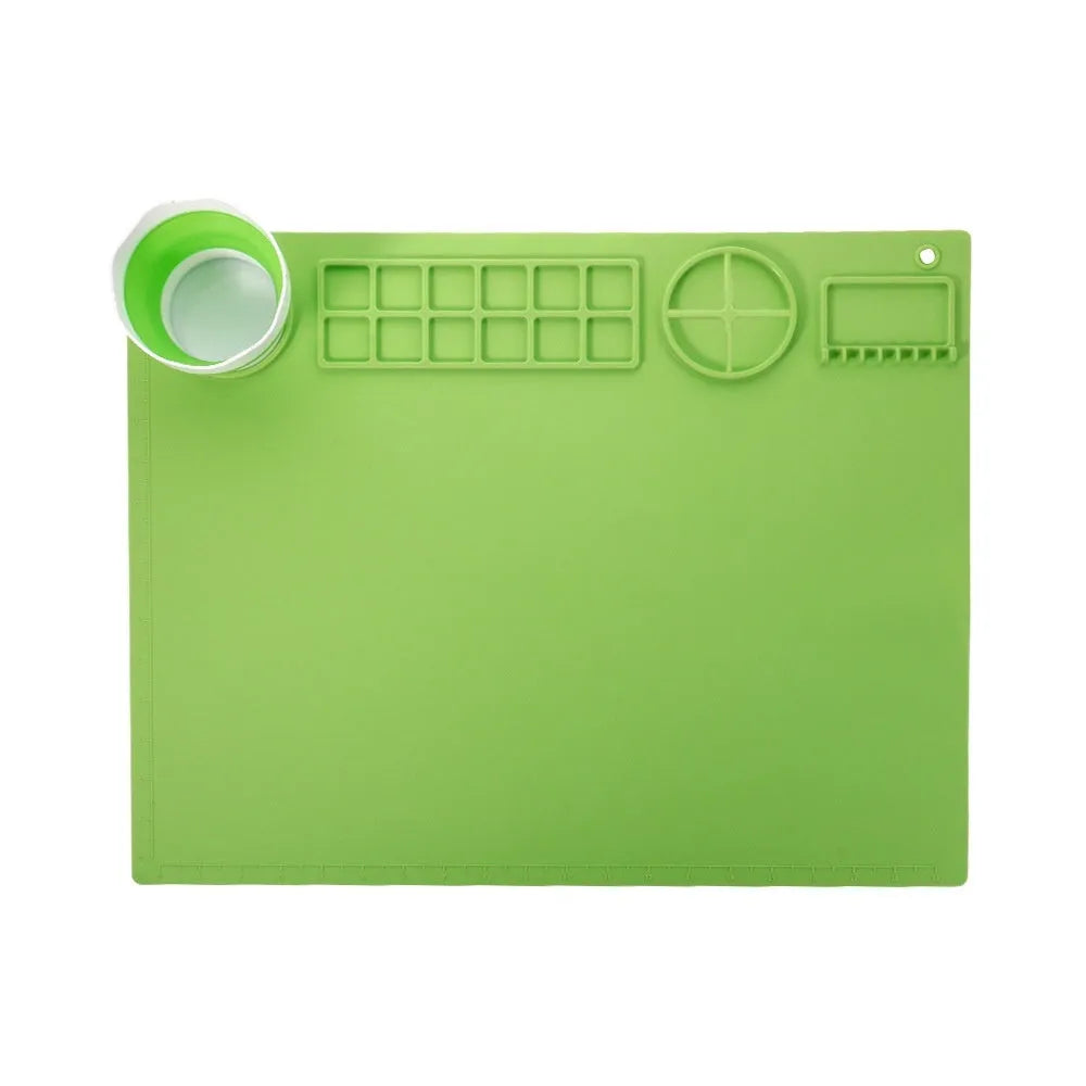 Light blue silicone painting mat with two built-in mixing bowls for graffiti and watercolour art.