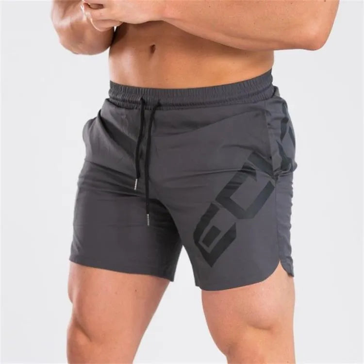 Men's black elastic running shorts with a mid-waist and knee-length cut on a plain background.