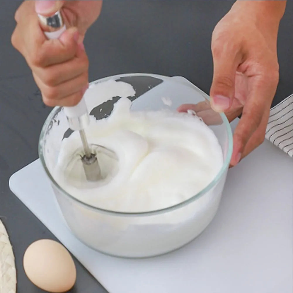 Semi-automatic manual egg beater whisk in stainless steel and white plastic