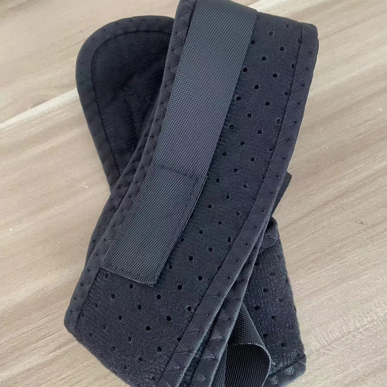 Babaka brand adjustable nylon posture correction band for back support.