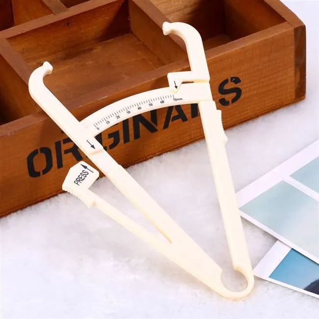Clear acrylic body fat caliper with measurement scale showing 200mm range and 0.001mm accuracy.