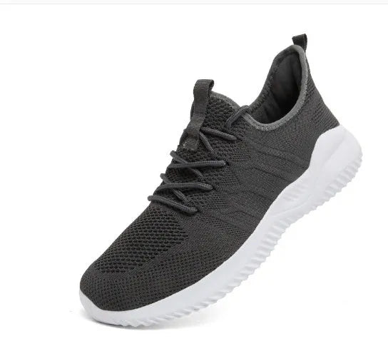 Men's black and white lace-up sport shoes with mesh upper and PVC sole for casual jogging.
