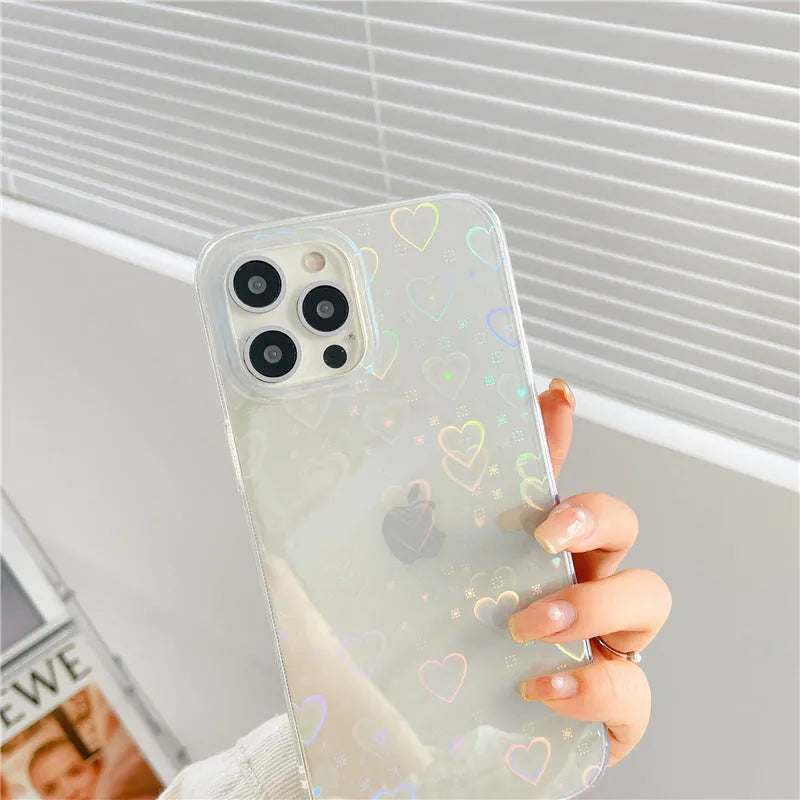 Transparent silicone iPhone case with a laser-etched love pattern, shown fitted on a phone.