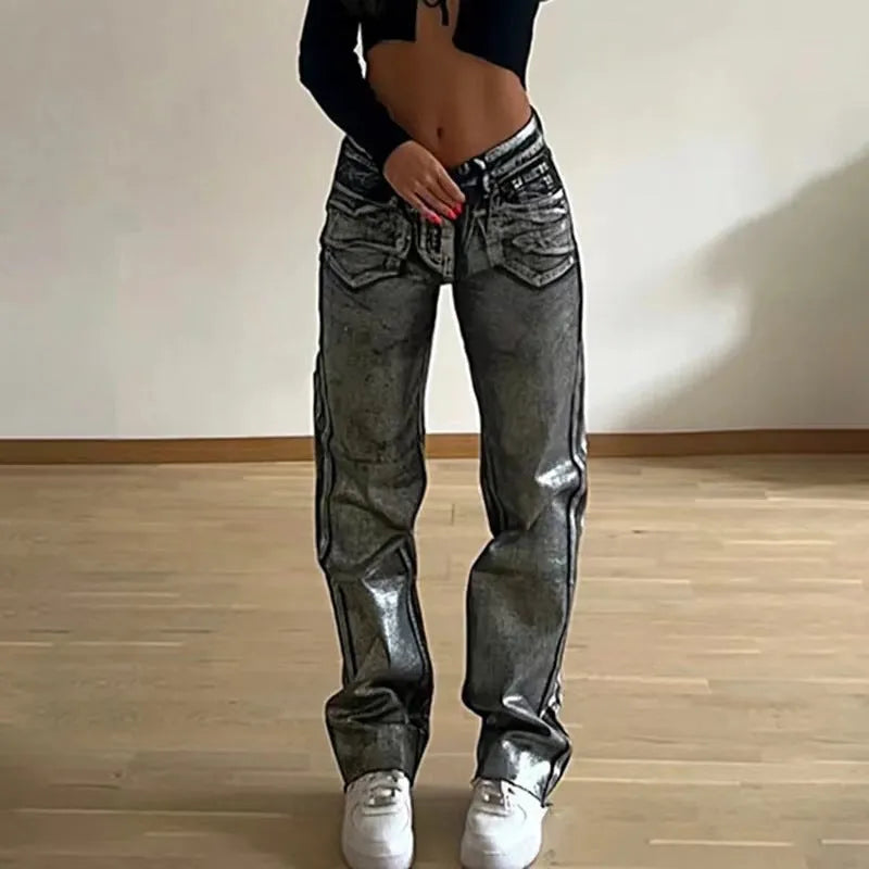 Blue high-waist straight-leg women's jeans with contrast colour detailing on a denim background.