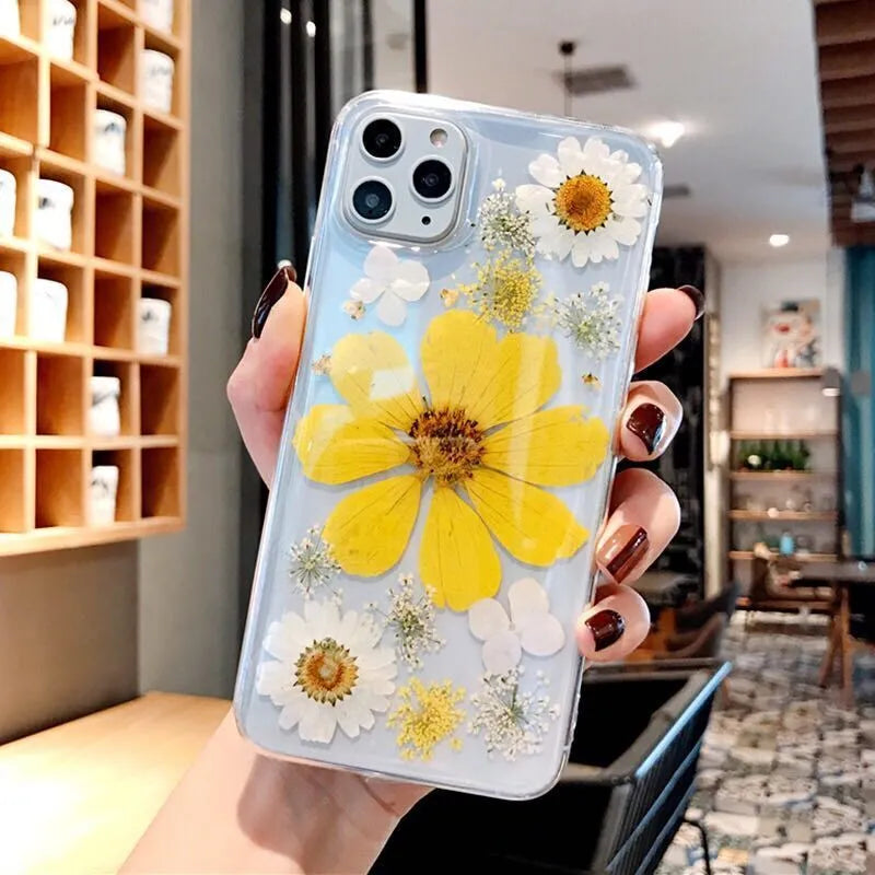 Pink and yellow floral print TPU back cover case for iPhone on a white background.