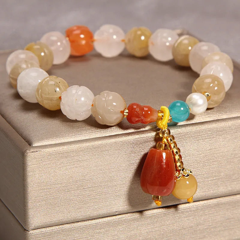 Natural garnet multi-layer crystal bracelet with strawberry quartz, moonstone, and pendant details in Korean light luxury style