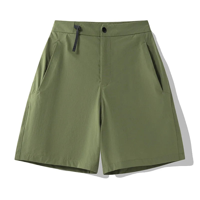 Men's solid colour quick-dry sports shorts with elastic sides on a neutral background.