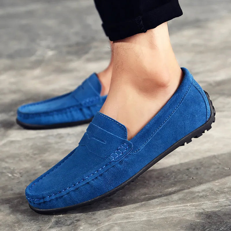 Men's brown suede casual loafers with flat rubber sole and round toe on a white background