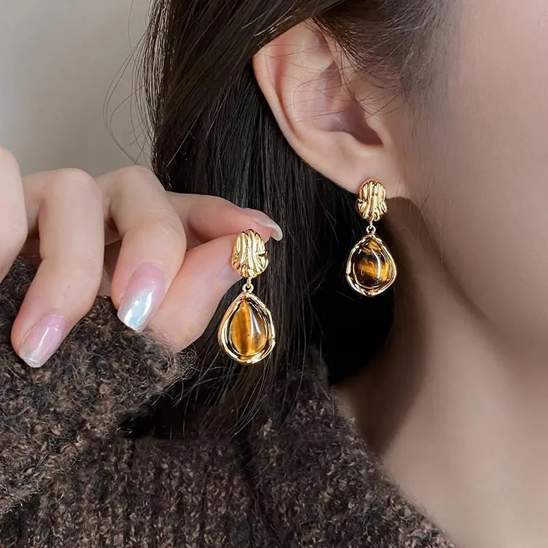 Handmade alloy holiday earrings set showing three geometric styles with tassel elements