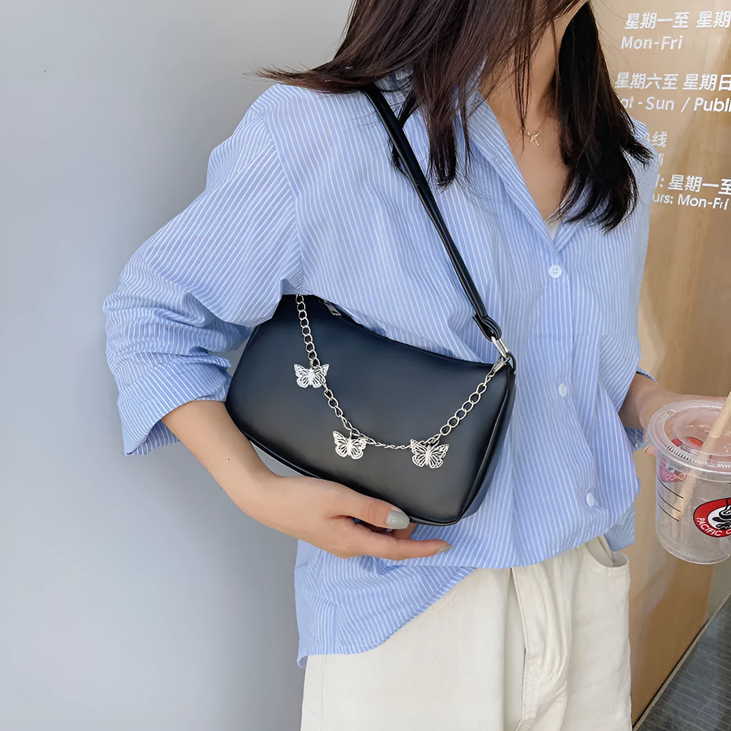 A structured square women's chain underarm bag in PU leather, shown in black, white, khaki, and light blue colour options.