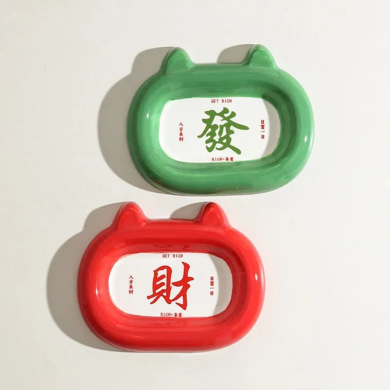 Ceramic pet bowl with an animal design, shown on a table.