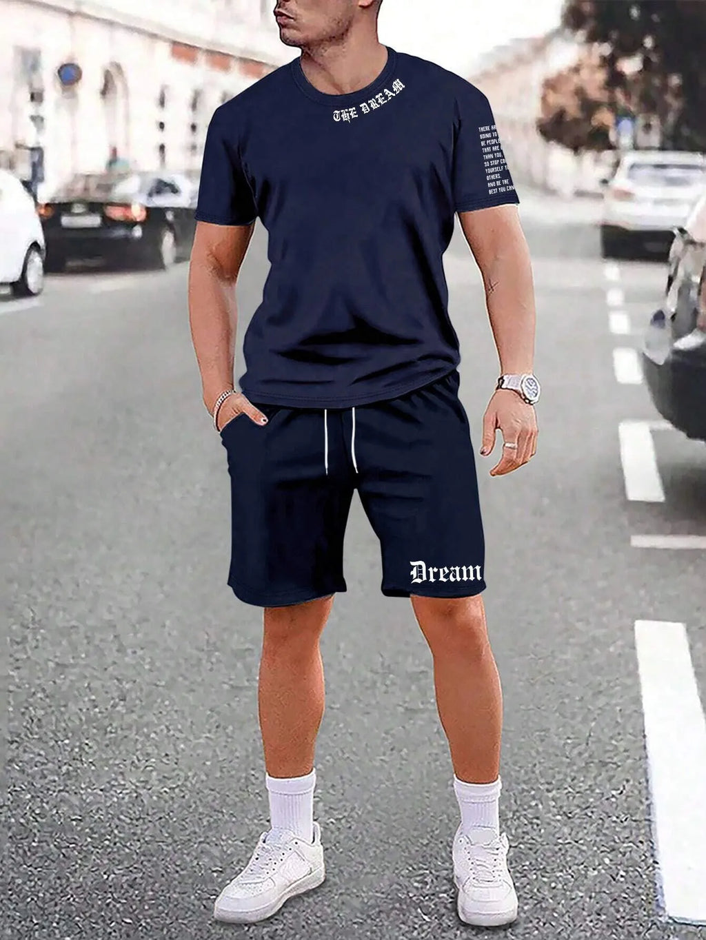 Men's grey sports short sleeve top and matching shorts set on hanger