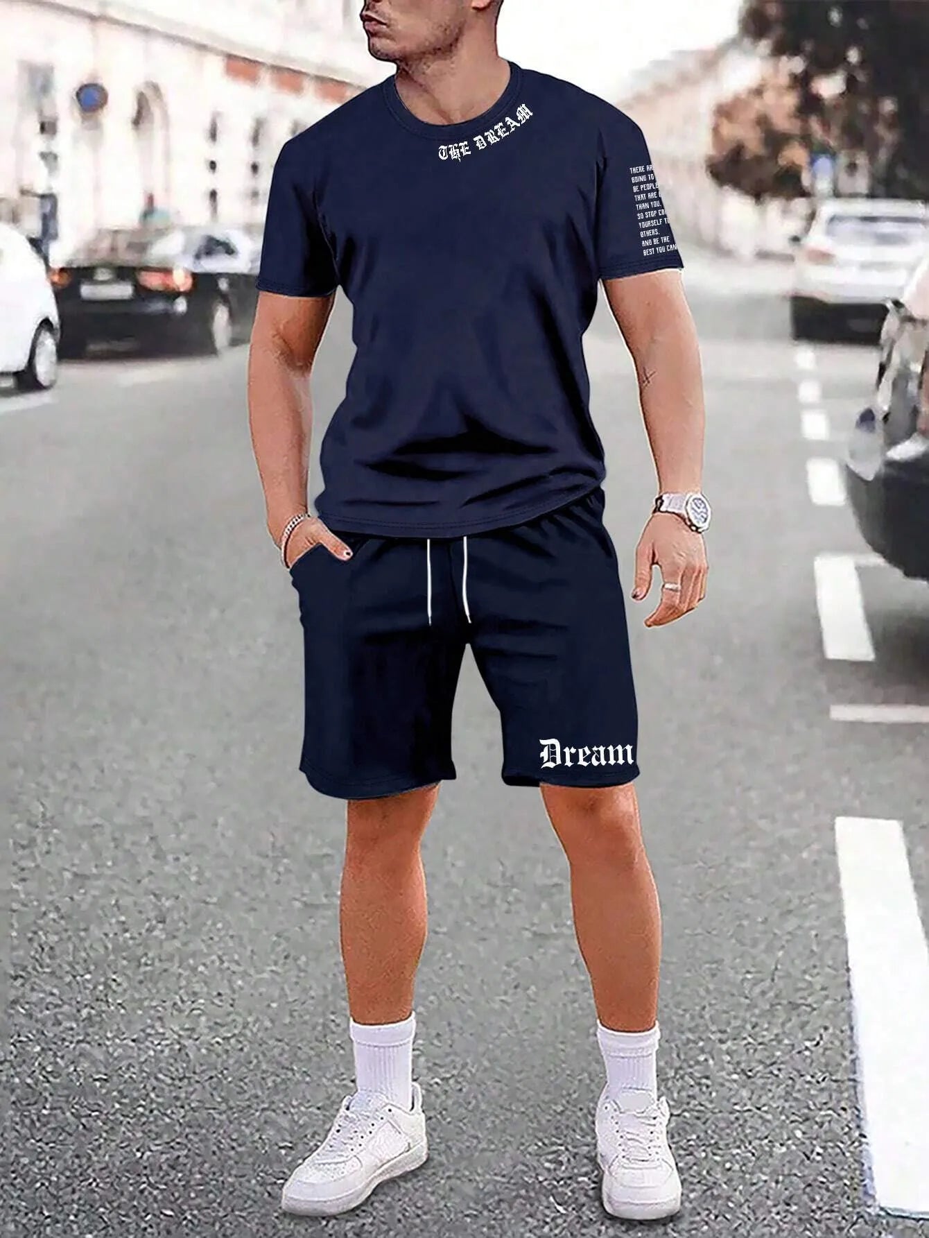 Men's grey sports short sleeve top and matching shorts set on hanger