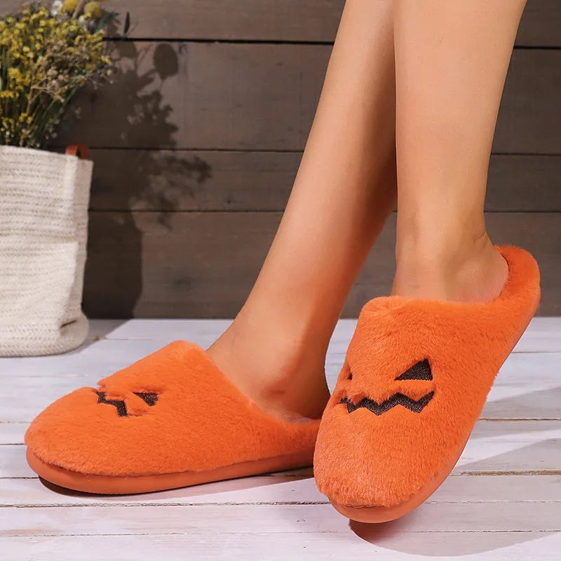 Orange Halloween pumpkin slippers with plush lining and textured coral velvet uppers