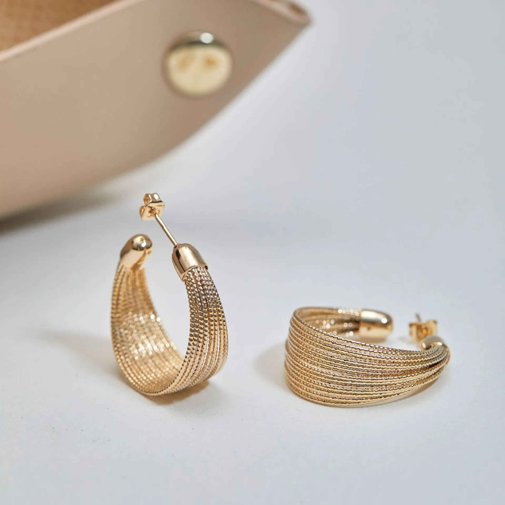 Geometric multi-layer simple bracelet earrings in gold and silver finishes with copper construction
