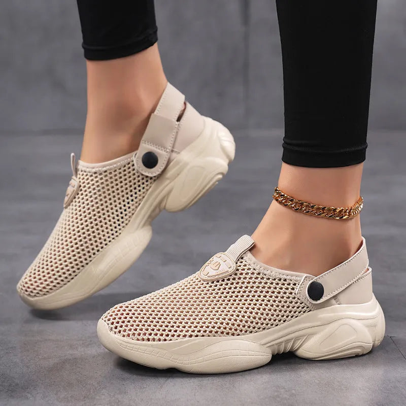 Women's beige Flyknit casual sports sandals with round toe holder, shown on a foot.