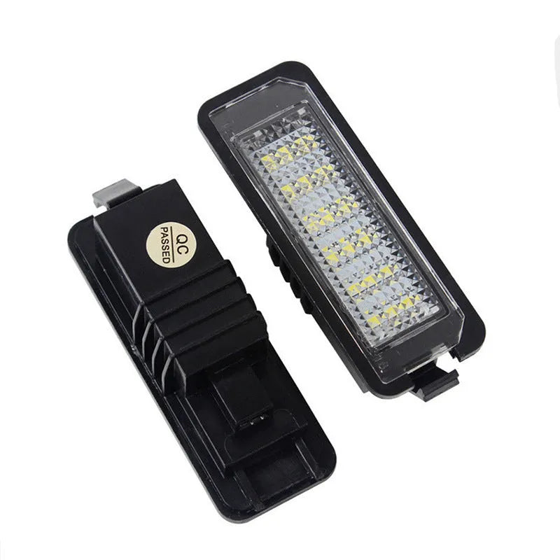Pair of white LED license plate light bulbs for Volkswagen cars with Canbus resistors.