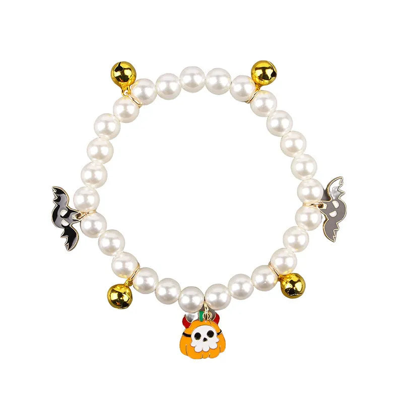 Halloween cat collar with simulated pearl decoration showing purple ghost, skull pumpkin, and smiling pumpkin design options