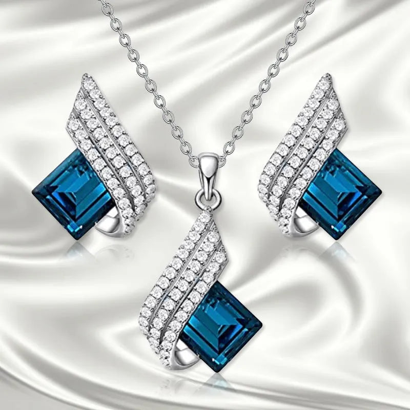 Glass and alloy necklace and earring set with cross chain styling and electroplated ornament details