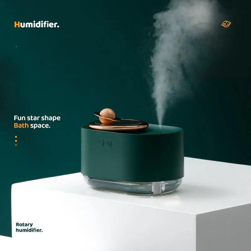Rotating planet humidifier with USB charging port and night light in green, pink, or white colours