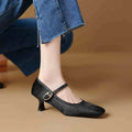 Women's black square toe stiletto ankle-strap heels with a horse hair upper and buckle closure.