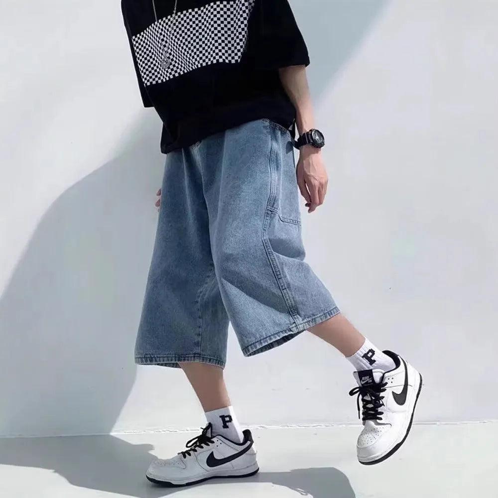 Men's blue washed denim pirate shorts with a high waist and cropped, straight leg.