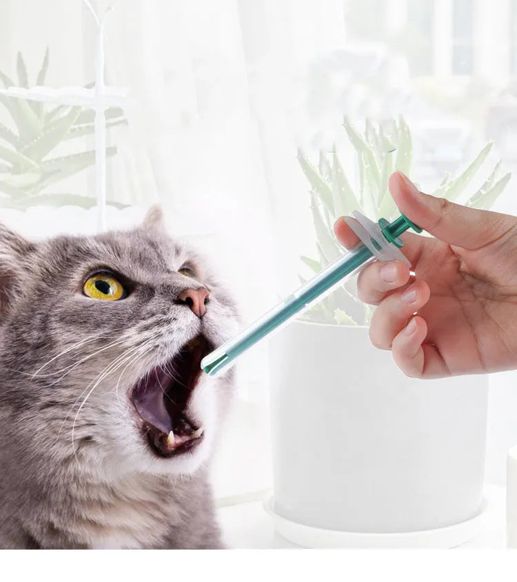 Two silica gel pet pill shooters for cats and dogs, showing soft tip and push rod.