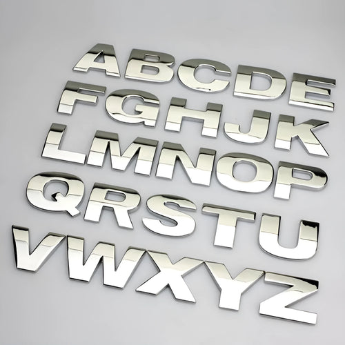 Zinc alloy metal car bumper sticker showing raised 3D letter design in approximately 2.5cm size