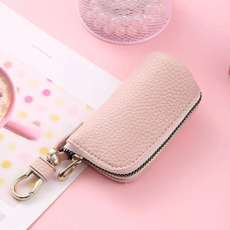 Minimalist black waterproof PU leather zip key pouch for car keys on table