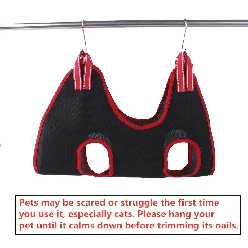 A pet grooming hammock restraint bag suspending a small dog, showing access points for paws during nail trimming.