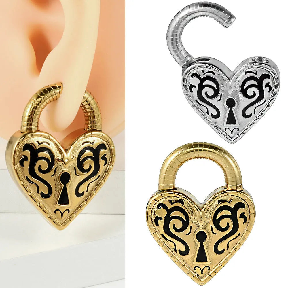 Close-up of a women's stainless steel heart-shaped earring with a gold electroplated finish.