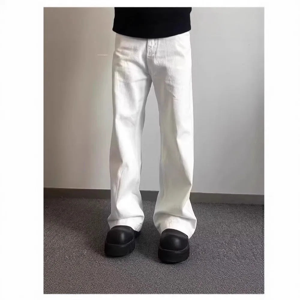 Men's white loose straight-leg jeans with wide leg openings and mid-waist design