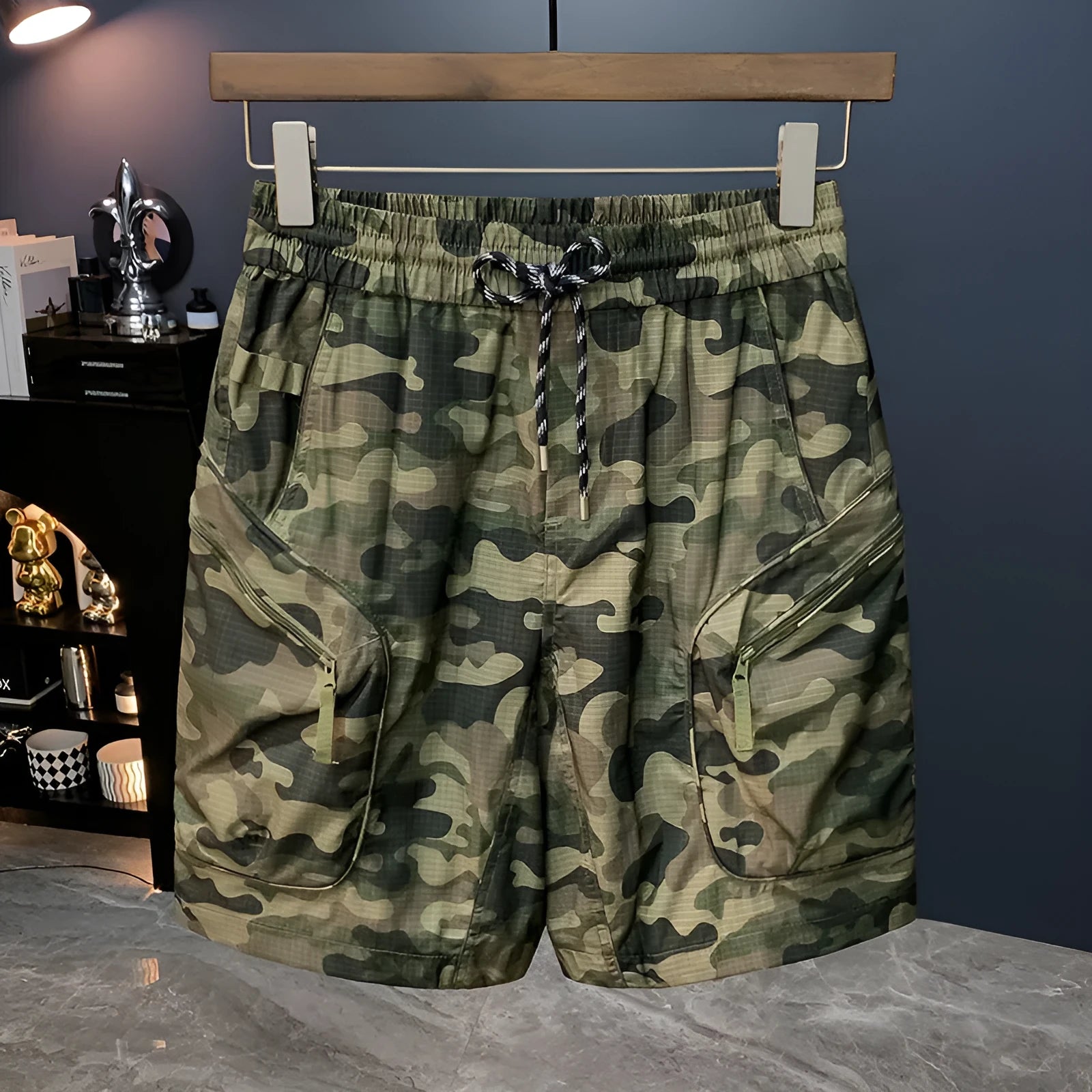 Man wearing loose-fit camouflage cargo shorts with multiple pockets, made from a cotton blend fabric.