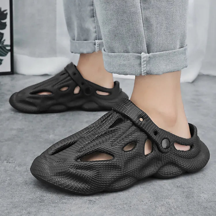 EVA soft men's summer beach shoes in grey colour on sandy surface