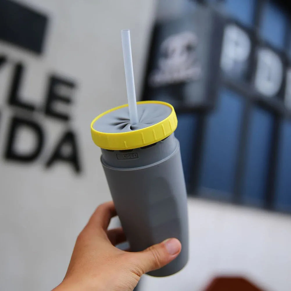 300ml green twist top lidless double wall travel cup with straw on blue background