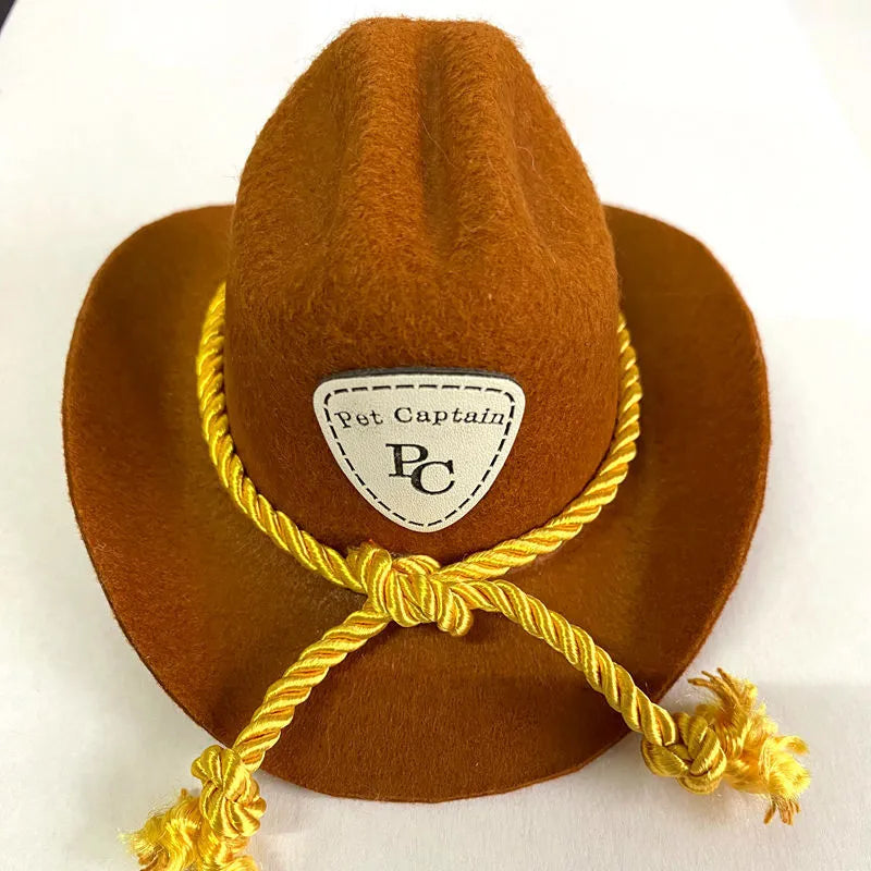 British-style brown cowboy hat for a cat with a black ribbon trim on a white background.
