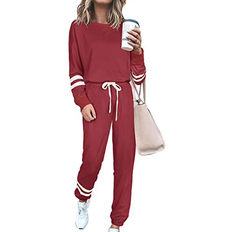 Women's plus size loose-fitting casual suit set in a solid colour, featuring a half-sleeve top and trousers.