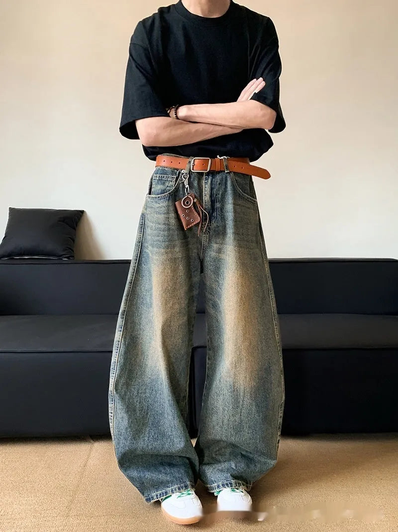 Men's retro blue wide-leg jeans with distressed detailing and machete wash effect