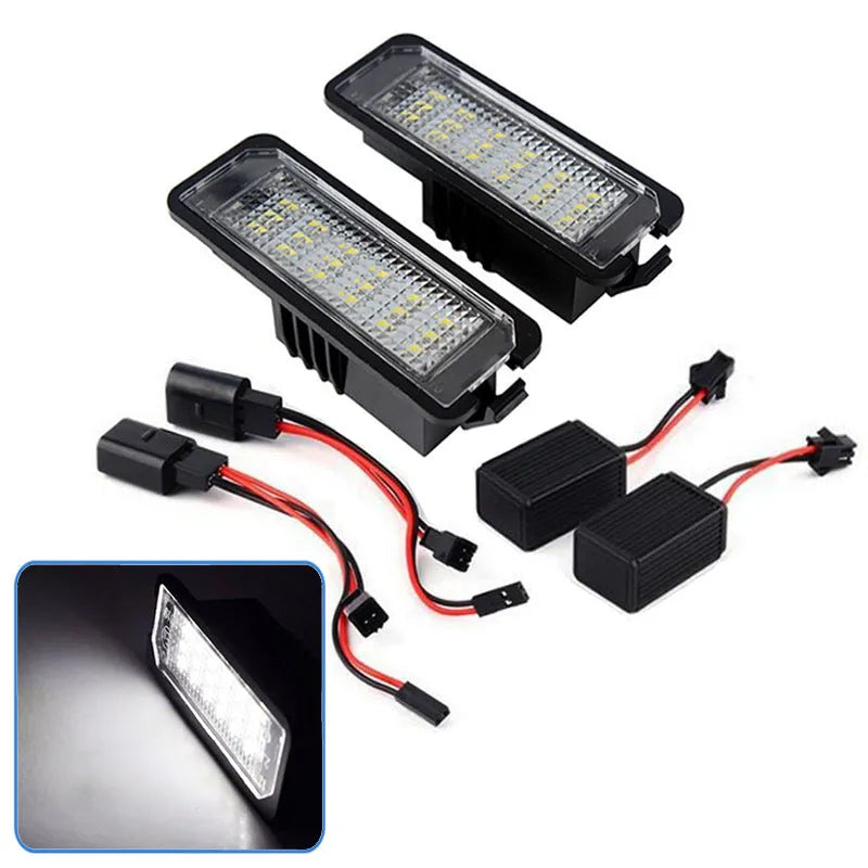 Pair of white LED license plate light bulbs for Volkswagen cars with Canbus resistors.