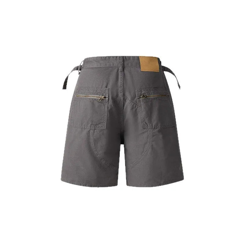 Retro grey washed cotton shorts with a zipper fly and loose fit on a mannequin.