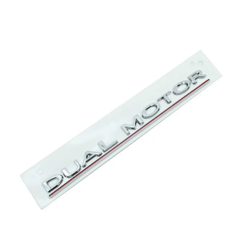 Black and red ABS plastic performance letter sticker for Tesla Model 3 bumper, measuring 19cm long.