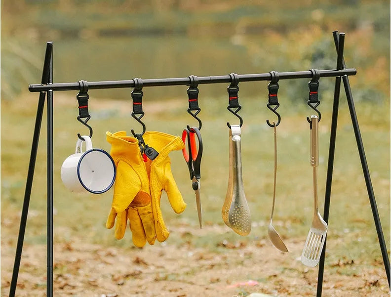 Aluminium foldable triangle camping clothes drying rack with 5 hooks displayed outdoors