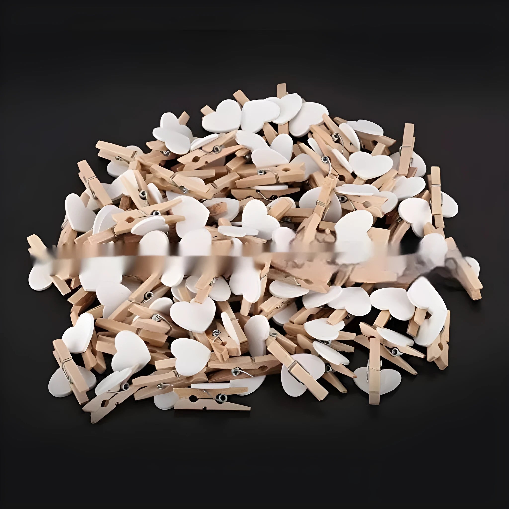 Set of five small wooden heart-shaped hair clips in various colours on a neutral background.